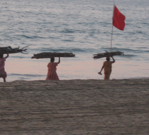 carrying canoes on beach