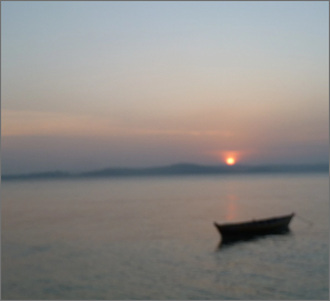boat on lake at sunset